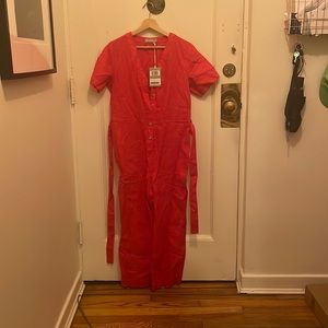 This is a brand new, never worn Everlane size 6 fire engine red jumpsuit!